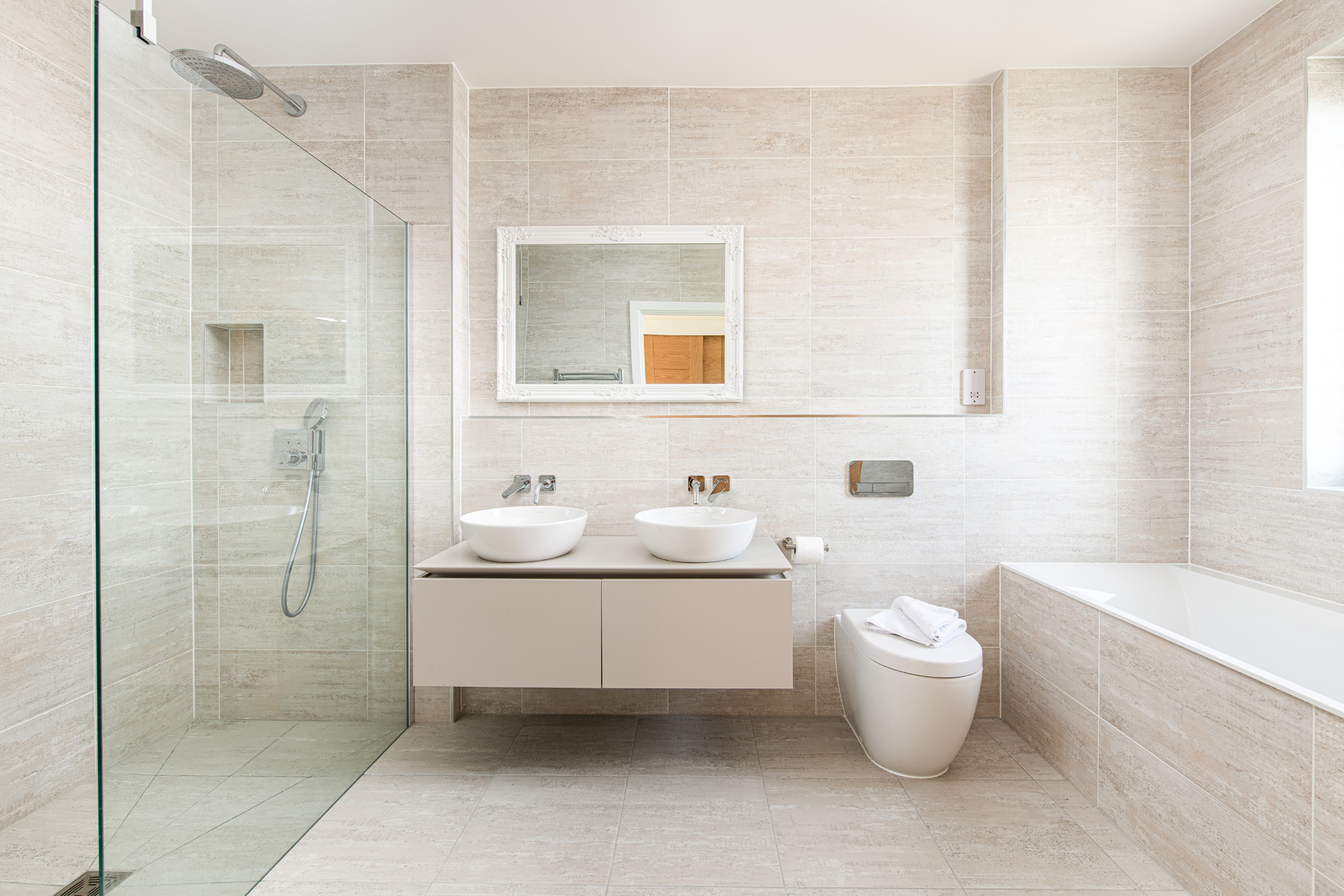 Luxury roomy bathroom with 2 sinks, bath and walk in shower