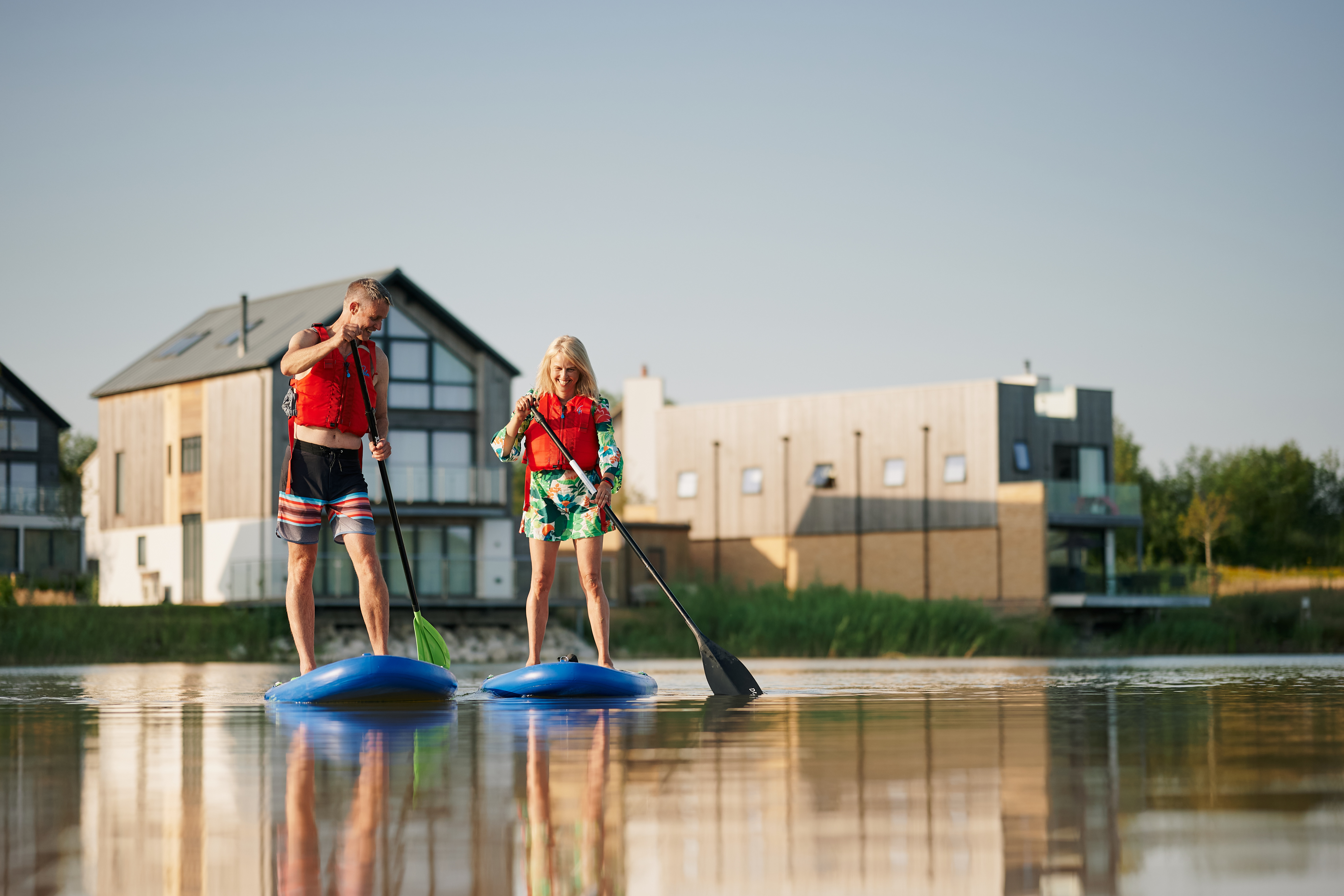 Two people paddleboarding at Silverlake