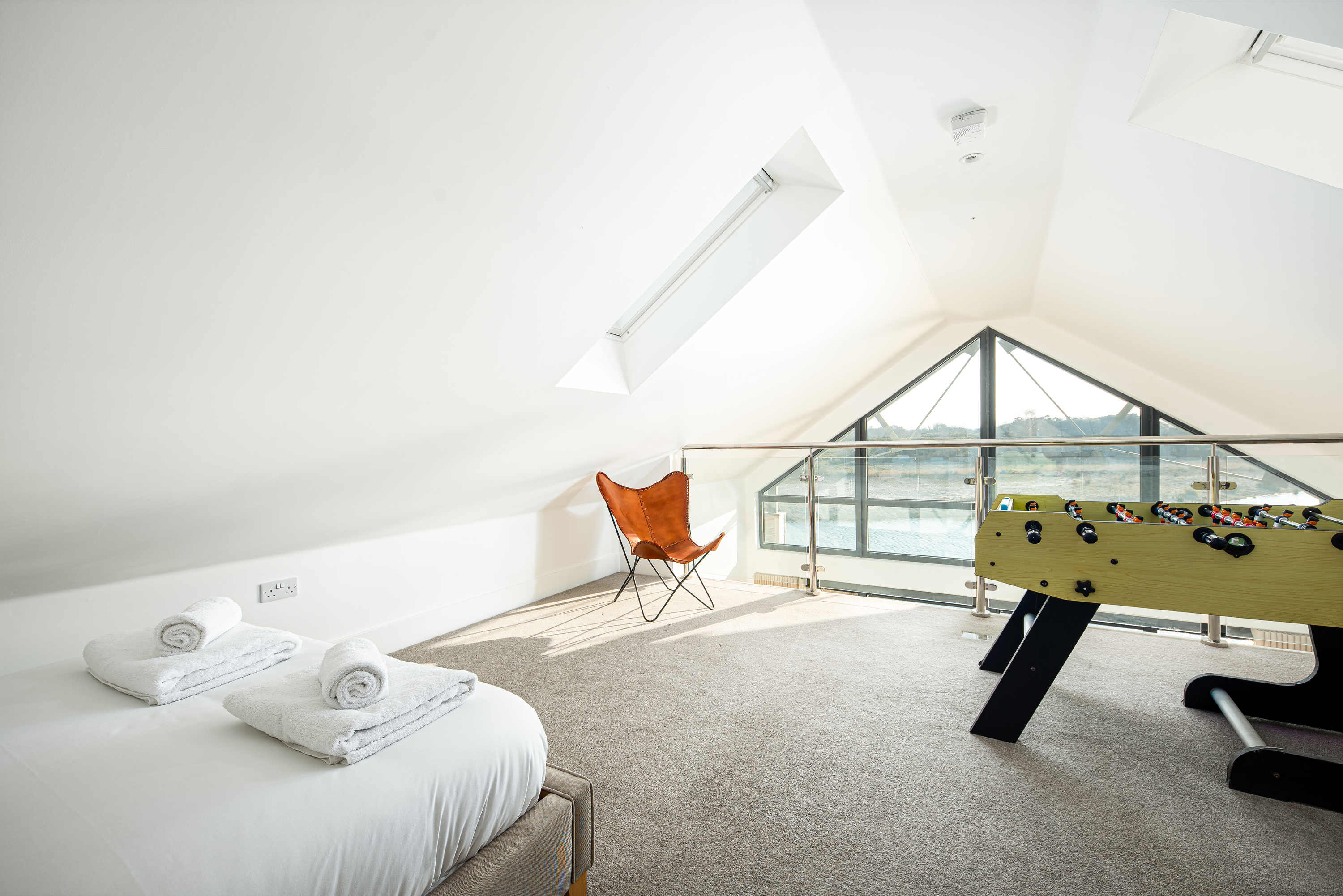 Large light attic bedroom with table football