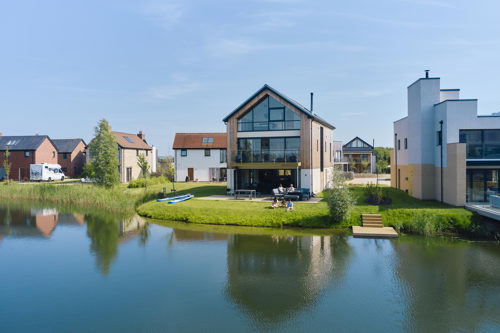 A large holiday home next to  still blue lake