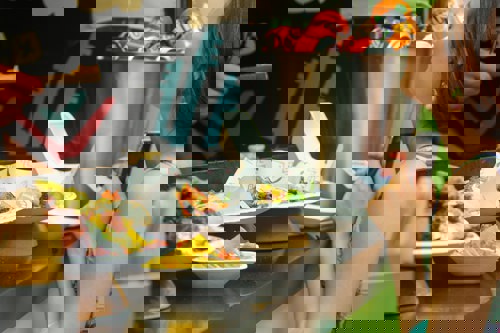 A girl buying food from a food stall