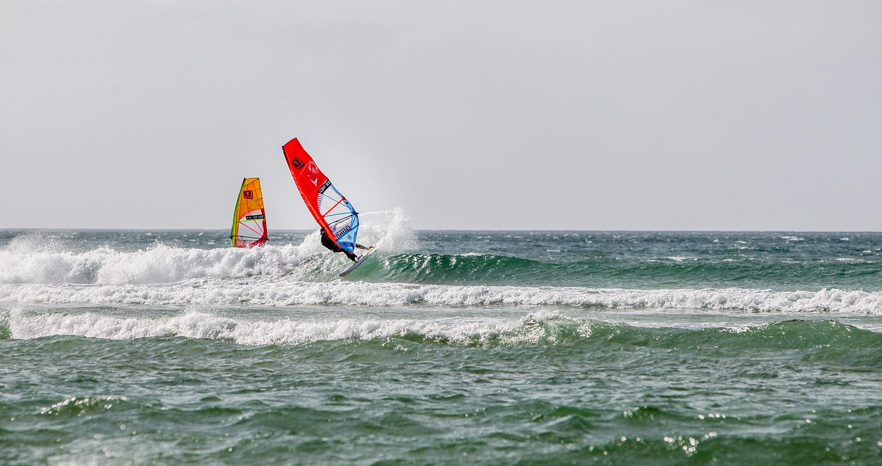 Two windsurfers on the sea
