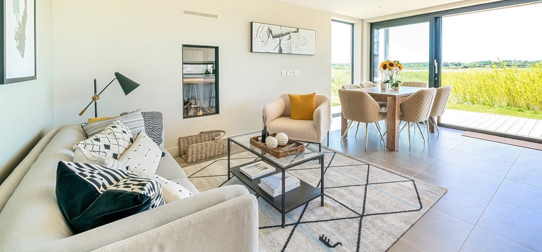 Open plan lounge and dining area looking out onto a field